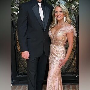 Turn heads in this Beautiful Rose Gold formal dress. Only worn ONCE
